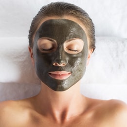 Woman with a face mask applied