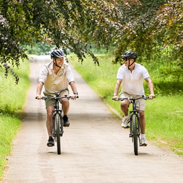 Two guests cycling on the grounds at Heythrop Park