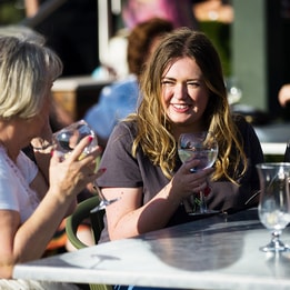Guests enjoying a drink on the Arden Terrace at Studley Castle.