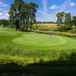 A guest playing golf at Heythrop Park