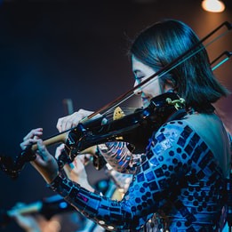 Close up of a violinist from behind