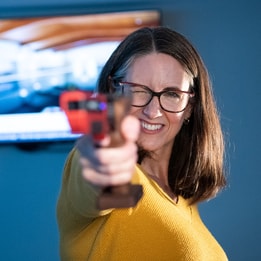 A guest playing laser pistol