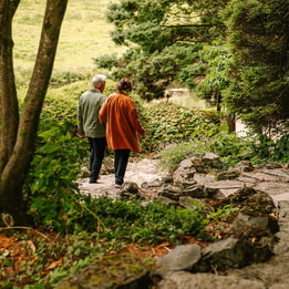 Couple holding hands discovering the grounds at Cricket st. Thomas