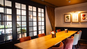 Long table with eight chairs in the gastropub style restaurants