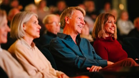 Guests enjoying an evening show