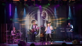 The Late Lounge at Heythrop Park, with a band performing on stage