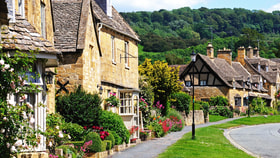 Immerse yourself in the beauty of the Cotswolds with a row of charming houses lining the streets.