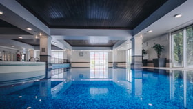 Pool view with relaxed lighting reflecting off the water