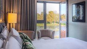 Bedroom with river view at The Runnymede on Thames