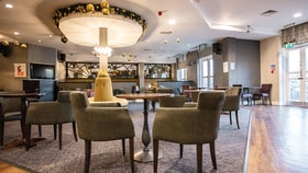 Contemporary hotel lounge bar with comfortable seating, modern décor and spacious social areas.