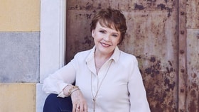 dana headshot in a white jacket