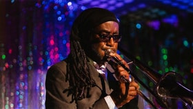 Ultimate 40 Reggae Band playing instrument