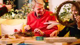 Guests creating their own christmas wreaths