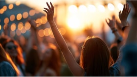 women outside with hands up