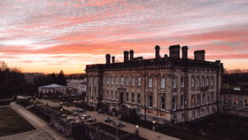 heythrop park hotel with a pink evening sky