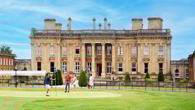 A group of guests playing golf at Heythrop Park.