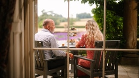 Couple enjoying afternoon tea at Cricket St. Thomas