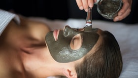 Person having a face mask applied