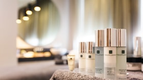 Temple Spa toiletries on a bed