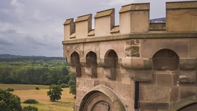 A majestic large stone tower stands tall at Studley Castle, emphasizing its grandeur and historical significance.