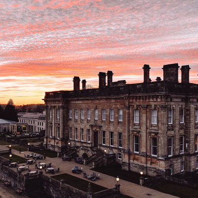 heythrop park hotel with a pink evening sky