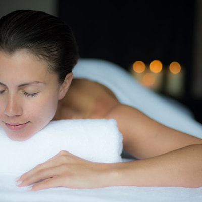 Person looking relaxed as they lay ready for a massage