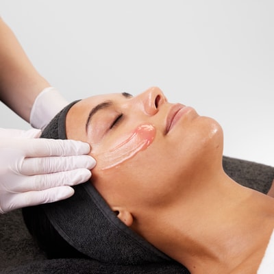 Women getting face massaged using medik8 products