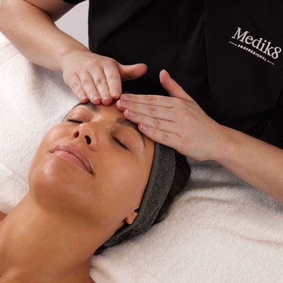 women in medik8 shirt giving a massage
