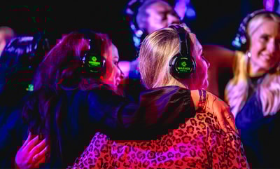 Guests enjoying silent disco at a Warner Hotel