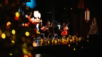Candle lit string quartet performing on stage