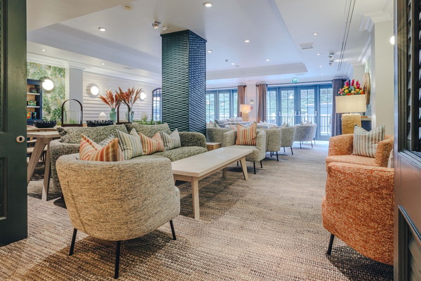 The Garden Room offers a quiet corner to pause and unwind. A comfortable place to sit back with a good book.