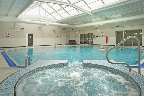 Soak in the soothing bubbles and enjoy a refreshing moment in the pool.