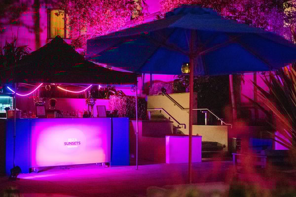 A touch of neon, a hint of evening magic - your perfect spot to unwind.