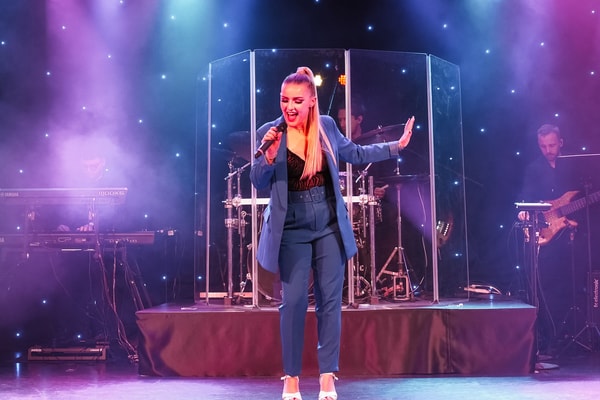 Under the spotlight, every note, every movement, captivates as the stage at Cricket St Thomas comes alive.