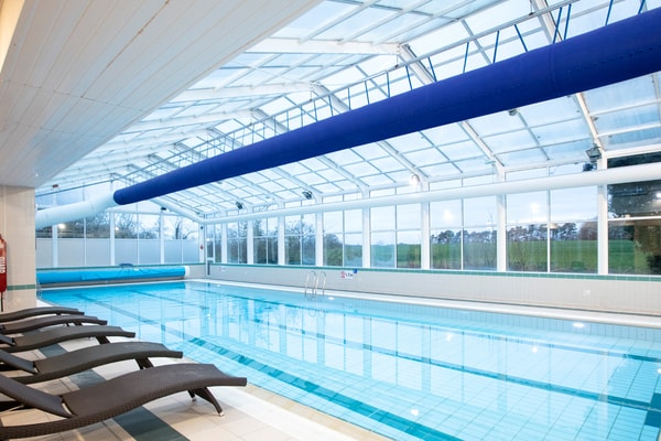 Take a dip in our heated indoor pool, where the glass walls and ceiling fills the space with light, creating a calm and inviting atmosphere.