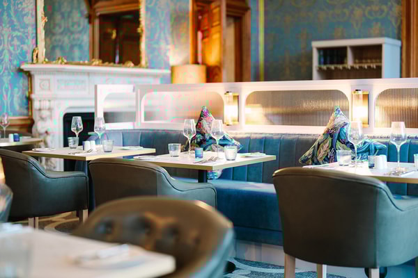 Every detail in The Blue Room is crafted for comfort and style, from the elegant table settings to the carefully chosen chairs.