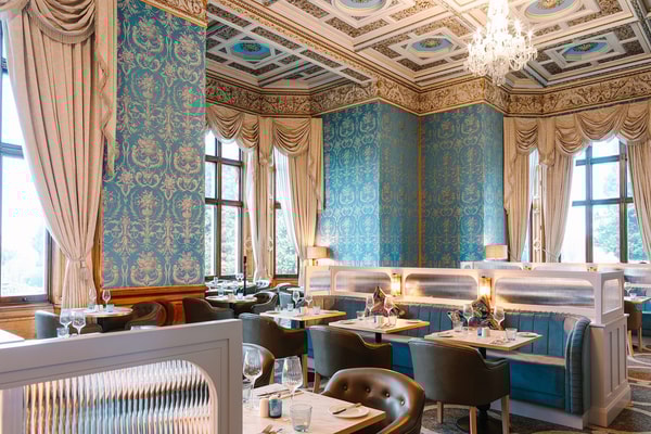Step into The Blue Room, where elegance meets modern dining in a beautifully designed setting.