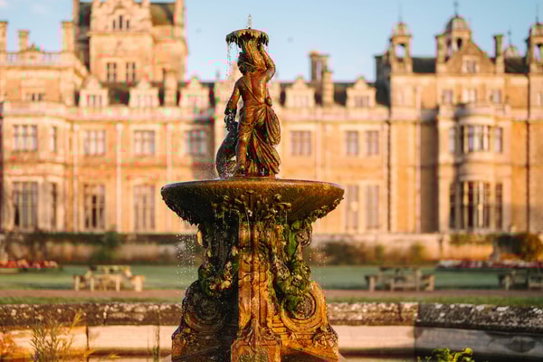 Where history flows: find this tranquil fountain framed by grandeur on the grounds of Thoresby Hall.