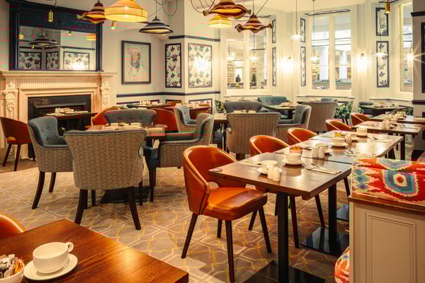 The Sherwood Restaurant, featuring the Market Kitchen, invites you to dine beneath a glass roof that floods the room with natural light, while the original outer walls reflect the building’s historic roots.