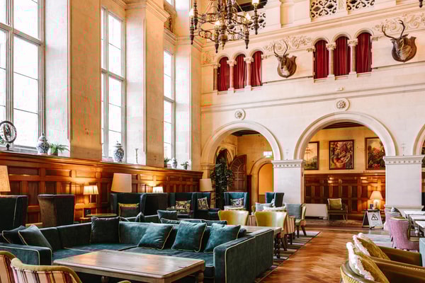 Historic charm meets everyday comfort in the Great Hall, where you can relax, play, and often catch a bit of daytime entertainment.