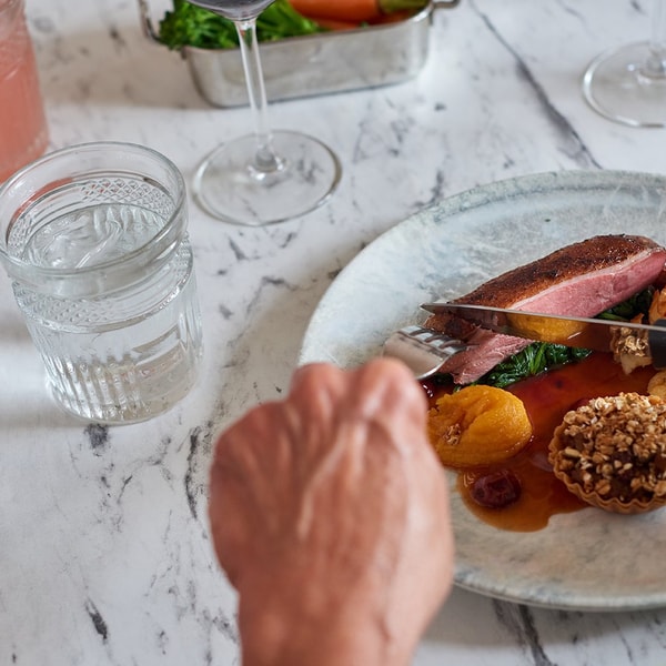 Main at Brasserie32: Duo of duck - Sliced duck breast, pulled duck ragu tartlet, spinach, dauphinoise potato, apricot puree, dark cherry sauce.