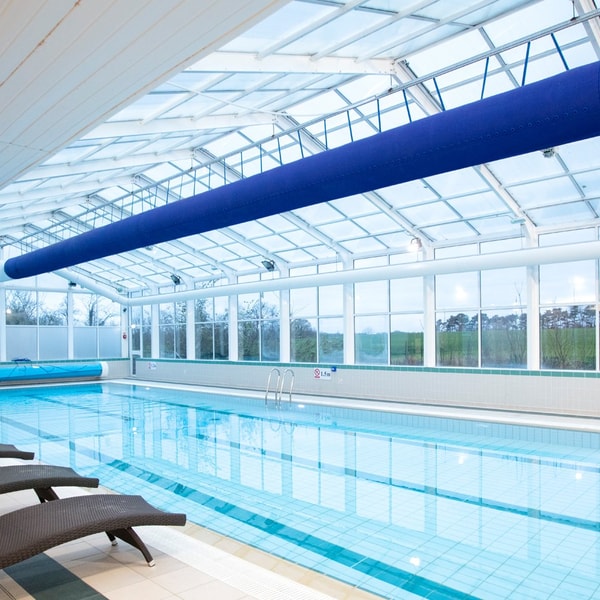 Take a dip in our heated indoor pool, where the glass walls and ceiling fills the space with light, creating a calm and inviting atmosphere.