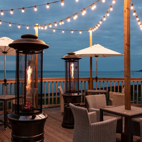 Cosy, warm, and inviting - enjoy a drink on the deck under the glow of fairy lights and the comfort of patio heaters.