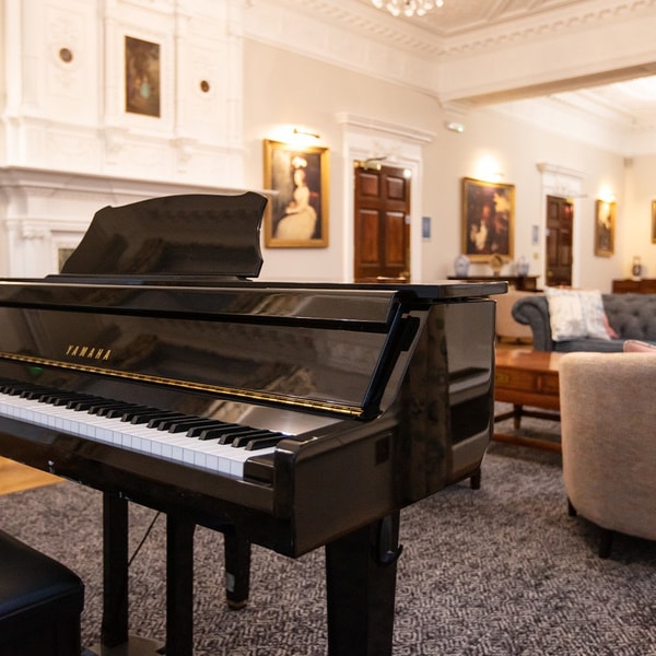 The drawing room is a perfect place to relax and unwind, often filled with the delightful sounds of piano music.