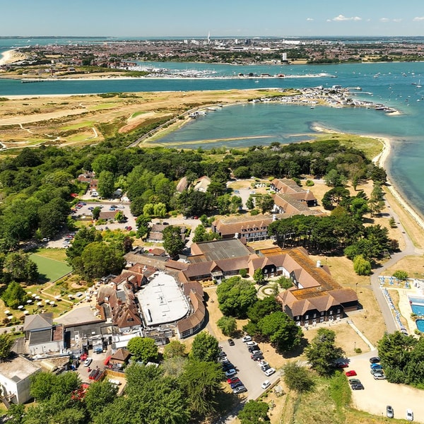 Who needs a postcard when you have this? This stunning aerial view of Sinah Warren showcases lush greenery and sparkling waters, just waiting to be explored during your stay.
