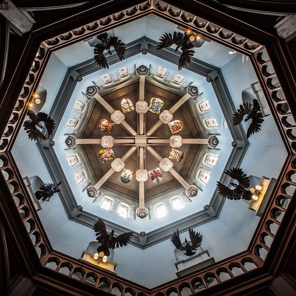 Step into Studley Castle’s main entrance and gaze up at the breathtaking circular ceiling, where intricate stained glass, dramatic statues and perfect symmetry create a truly unforgettable first impression.