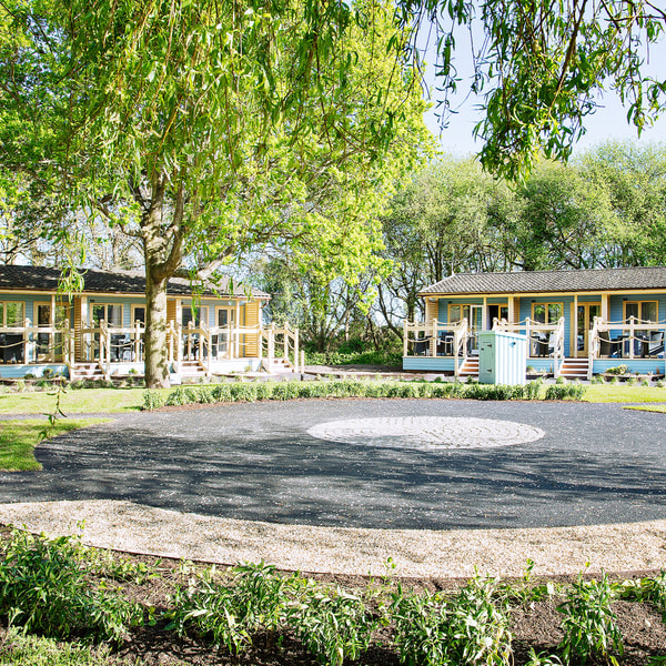 Surrounded by trees and the tranquility of nature, our Woodland Lodges offer a peaceful retreat that’s loved by our guests.