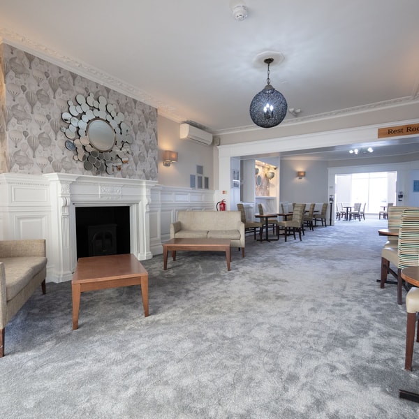 With a cosy fireplace and welcoming chairs, the lounge is perfect for relaxing or spending time with friends.