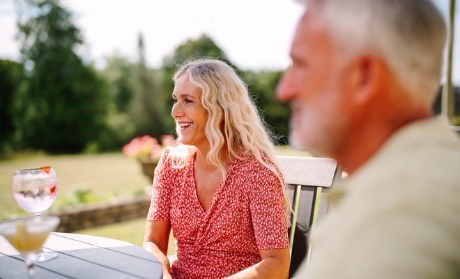 Guests having drinks on the terrace at Cricket St. Thomas