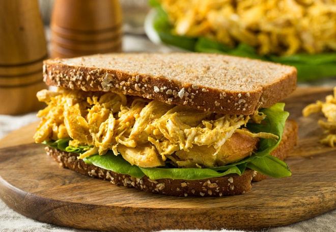 Coronation chicken with lettuce in a sandwich